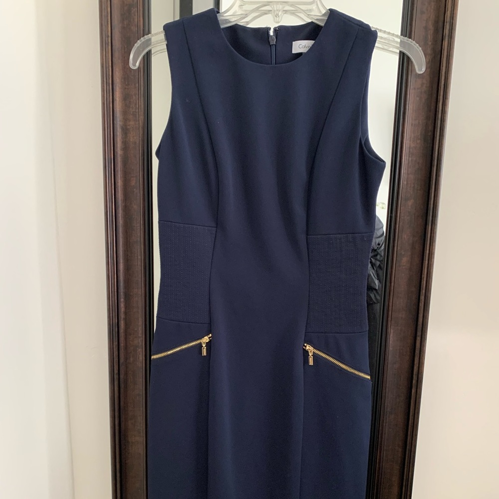 Calvin Klein sheath navy blue dress. Size small. Gold zipper pockets